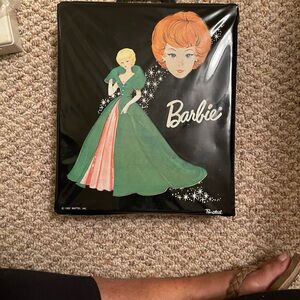 Three Barbies with case, clothing and accessories.